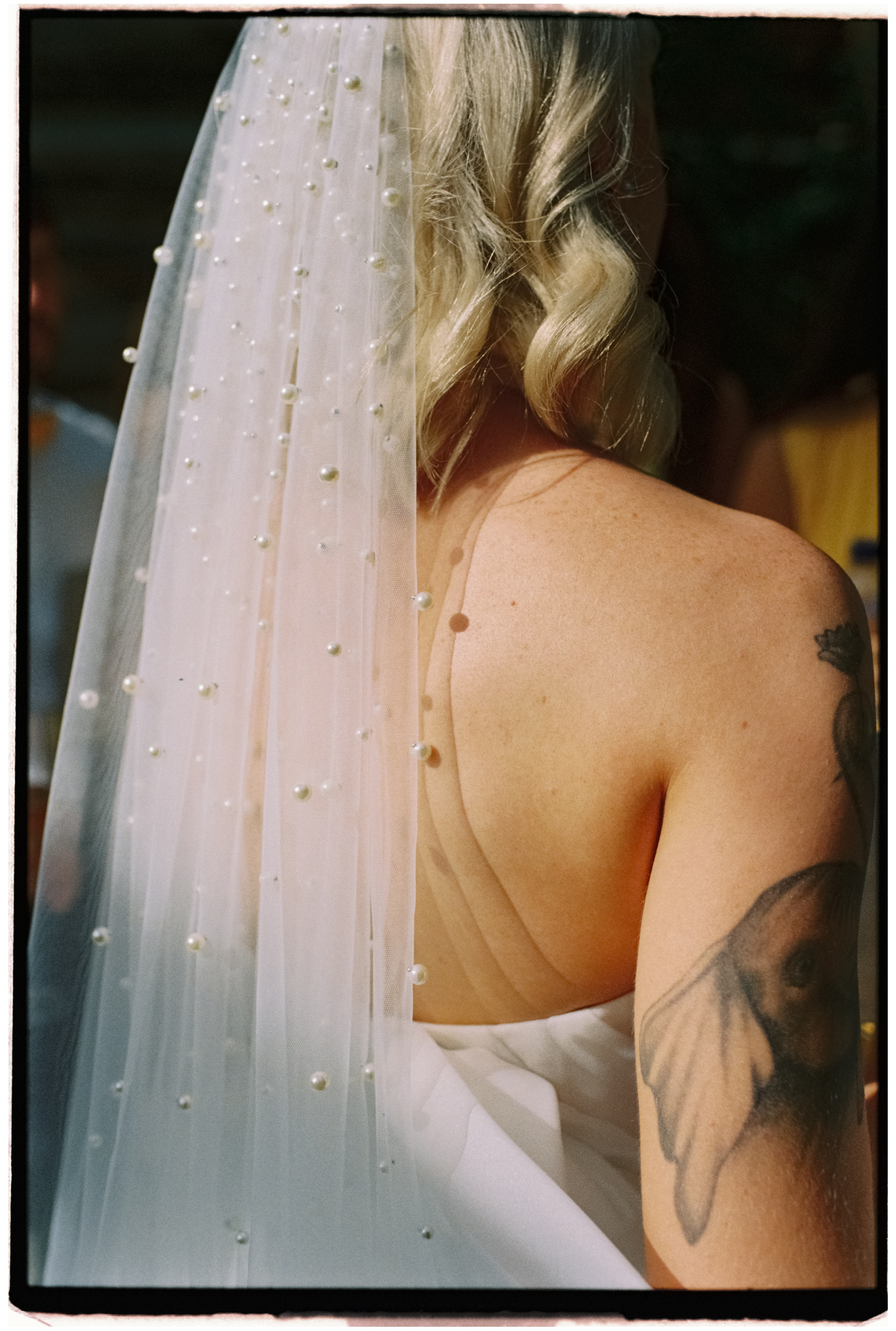 A detail shot of pearls in the bride's veil.