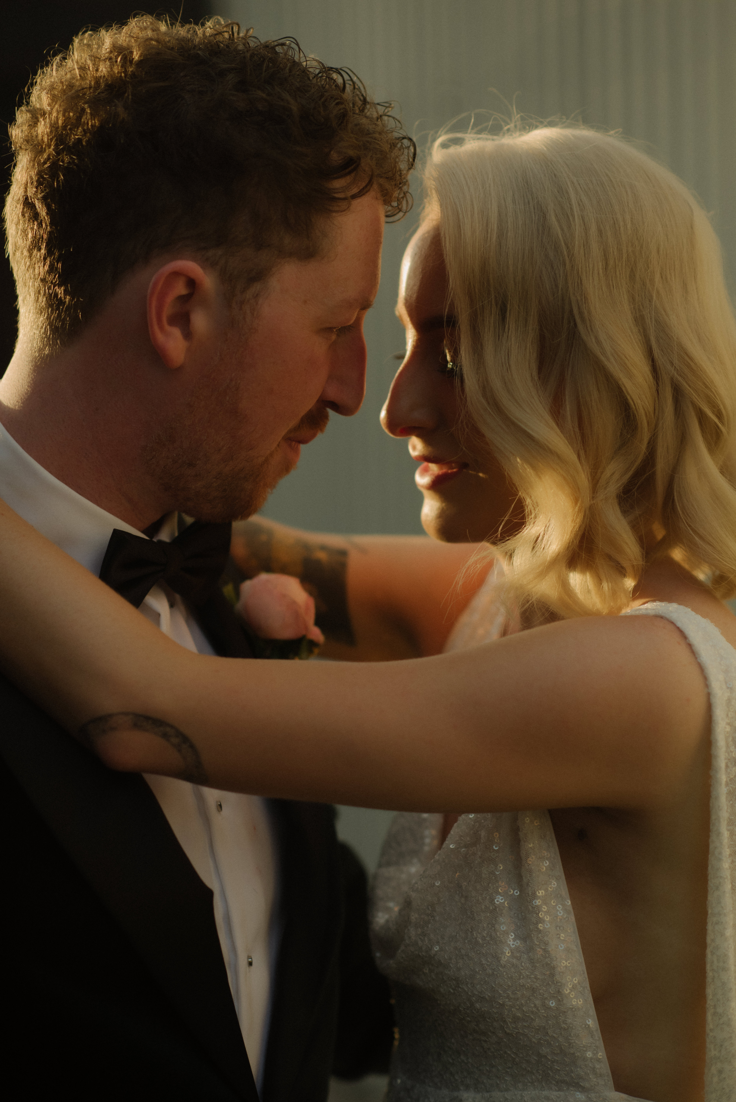 A bride and groom share a quiet moment during sunset outside Glasshaus Inside in Cremorne, Melbourne.