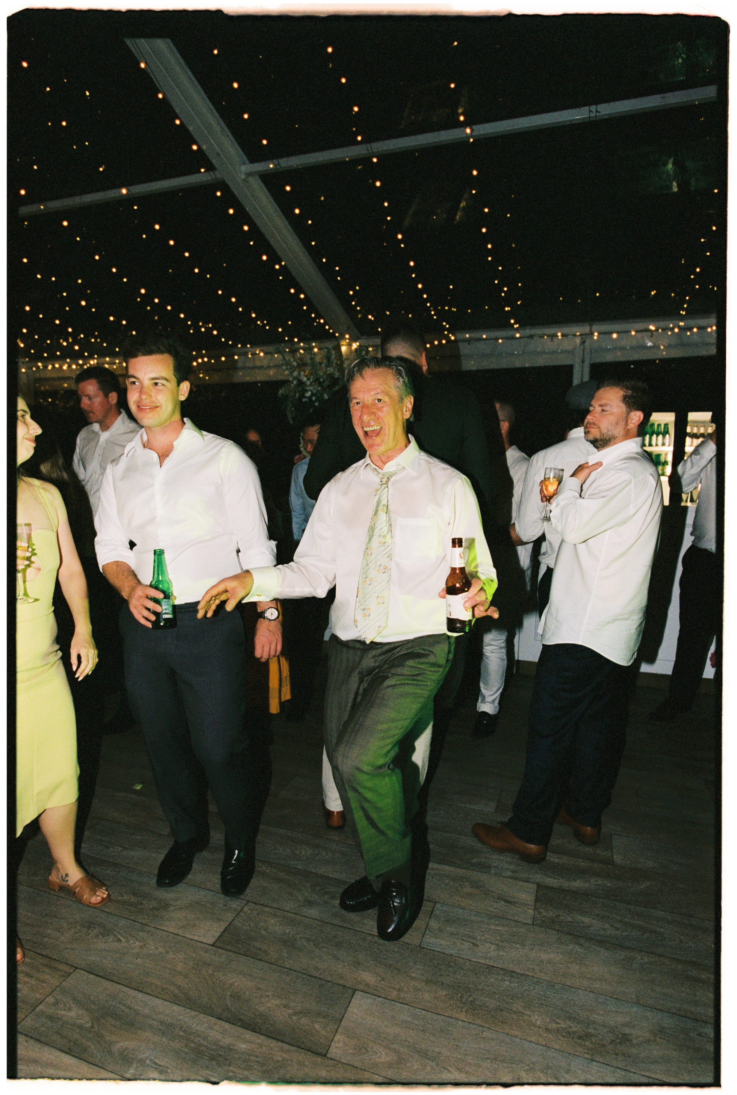 The father of the bride dancing during the wedding reception at Gardens House, Melbourne.